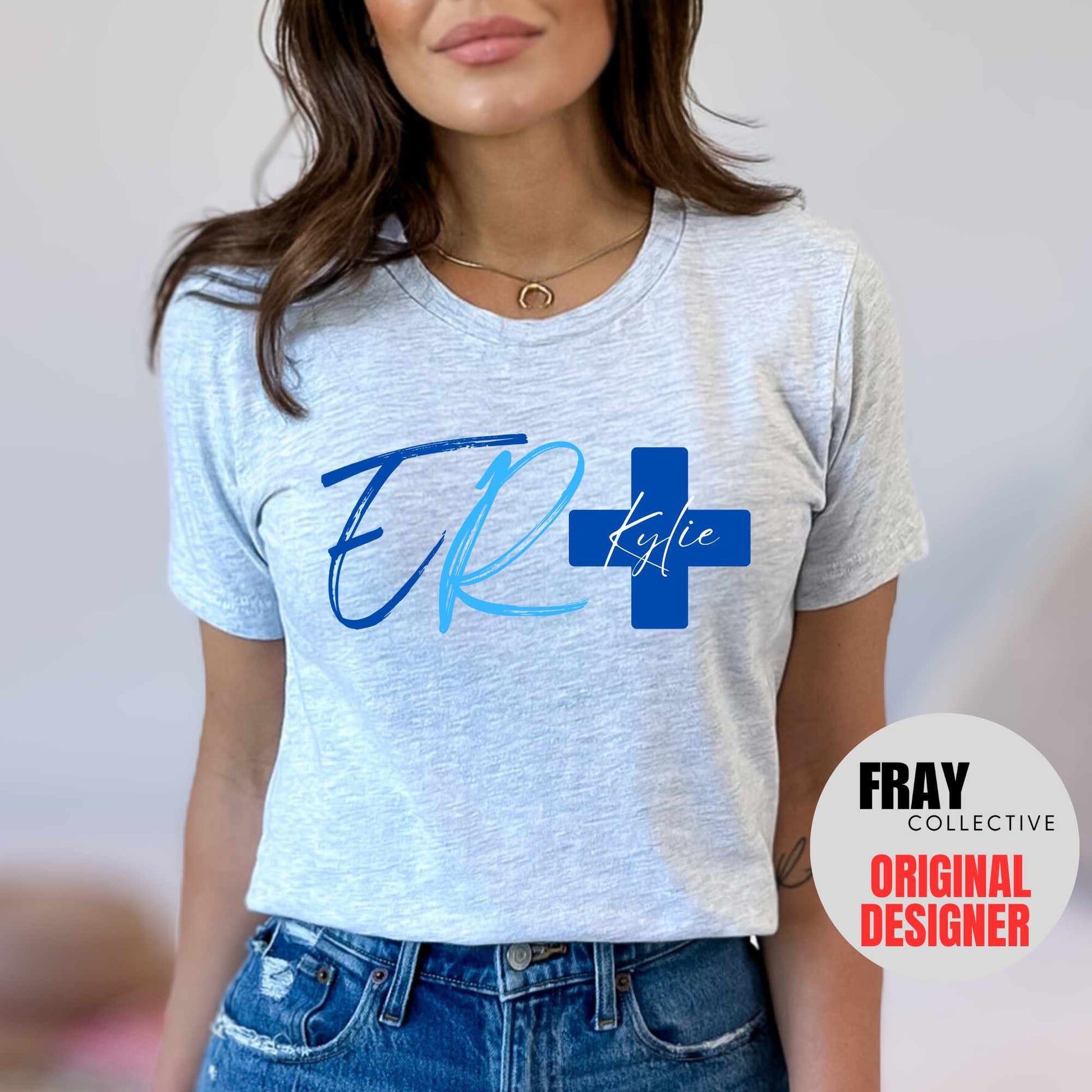 Personalized ER nurse/tech shirt—navy tee with modern ER lettering and blue cross showing custom name and credentials; great for emergency department teams.