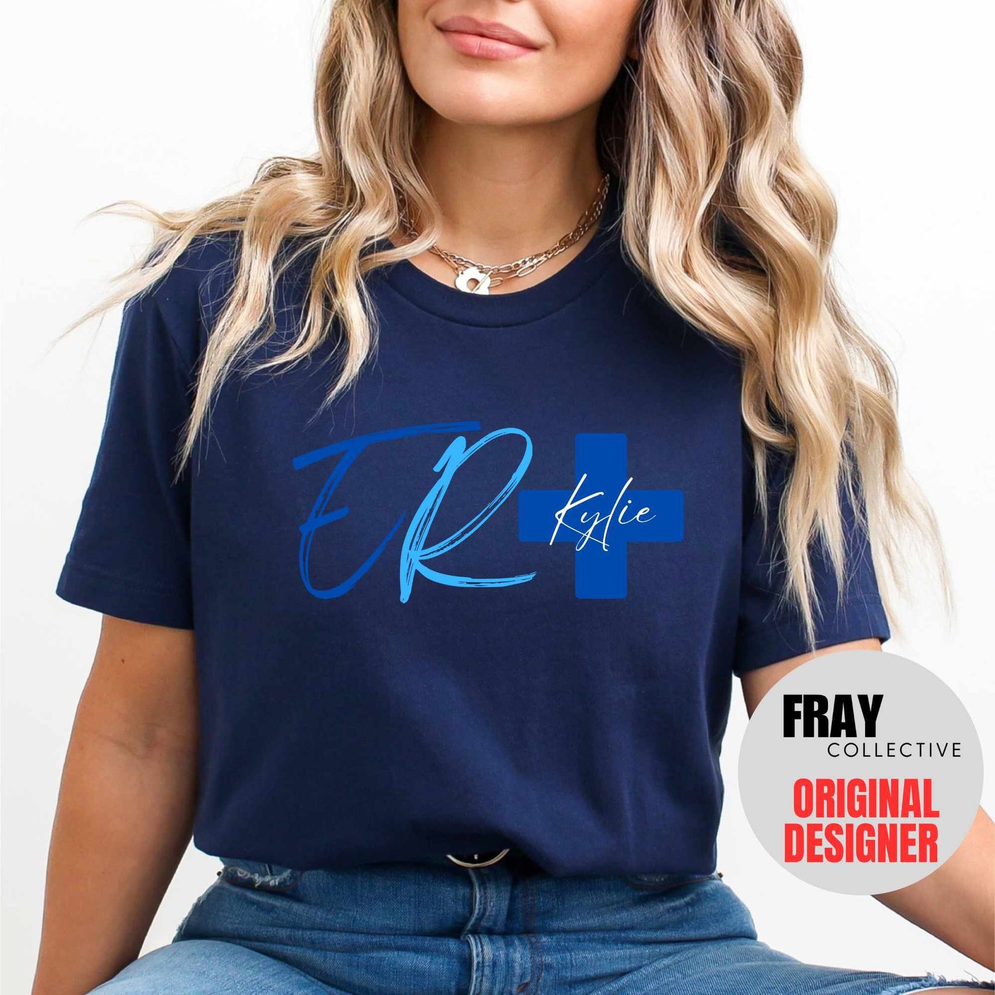 Personalized ER nurse/tech shirt—navy tee with modern ER lettering and blue cross showing custom name and credentials; great for emergency department teams.